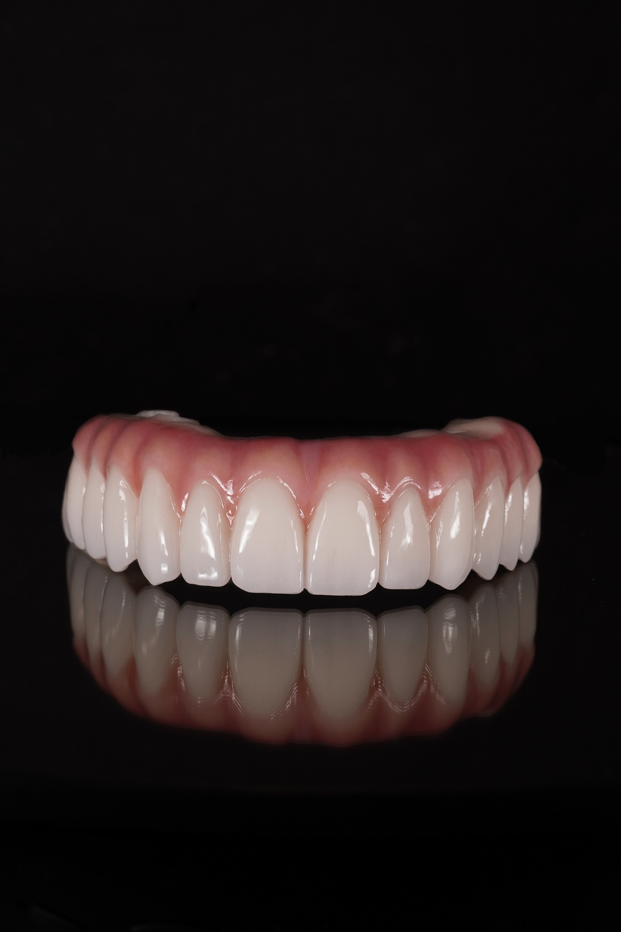 Green to Pink AOX zirconia bridge, finished and polished